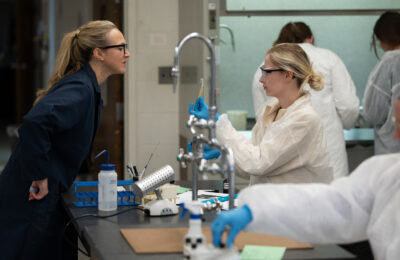 Biology, Biotechnology, and Health Science student and professor in a New England College Biology Lab